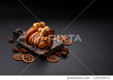 Sweet crispy croissant with salted caramel and glazed popcorn Sweet crispy croissant with salted caramel and glazed popcorn 120550471