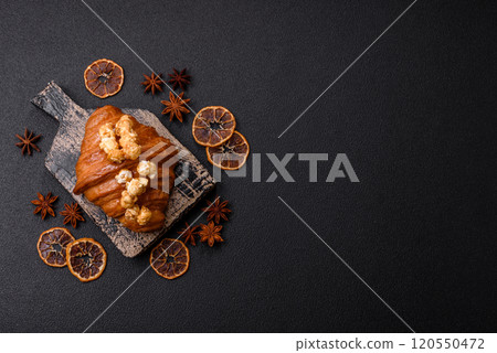 Sweet crispy croissant with salted caramel and glazed popcorn Sweet crispy croissant with salted caramel and glazed popcorn 120550472