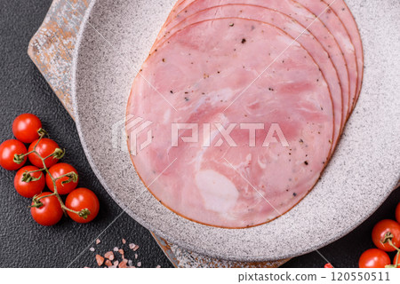 Ham cut into round slices with salt, spices and herbs Ham cut into round slices with salt, spices and herbs 120550511