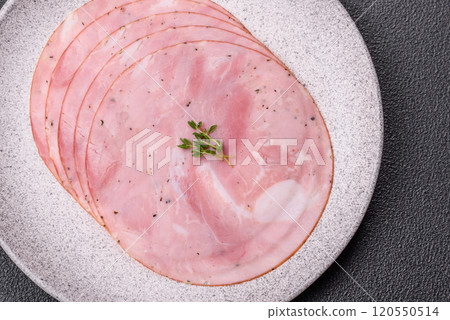 Ham cut into round slices with salt, spices and herbs 120550514