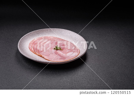 Ham cut into round slices with salt, spices and herbs Ham cut into round slices with salt, spices and herbs 120550515