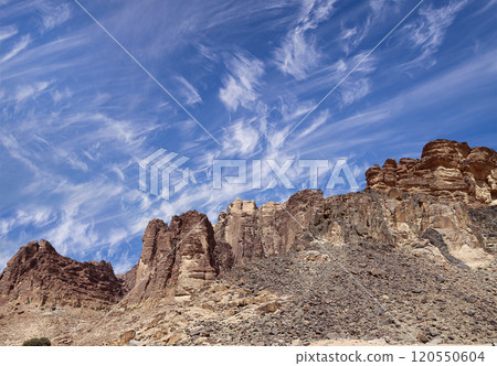 Mountains of Wadi Rum Desert also known as The Valley of the Moon is a valley cut into the sandstone and granite rock in southern Jordan 60 km to the east of Aqaba Mountains of Wadi Rum Desert also known as The Valley of the Moon is a valley cut into the sandstone and granite rock in southern Jordan 60 km to the east of Aqaba 120550604