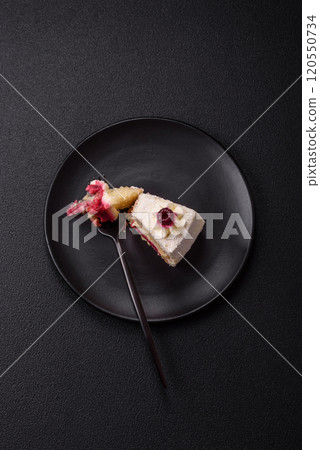 Sweet delicious cake with a layer of raspberry jam 120550734
