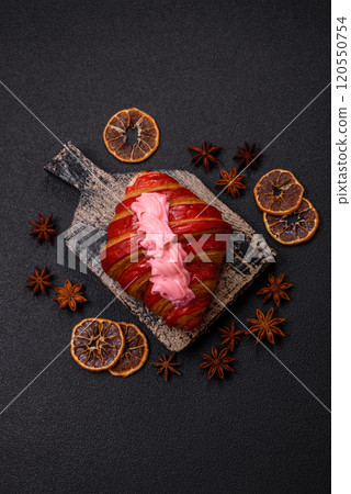 Crispy fresh red croissant with cream and strawberries Crispy fresh red croissant with cream and strawberries 120550754