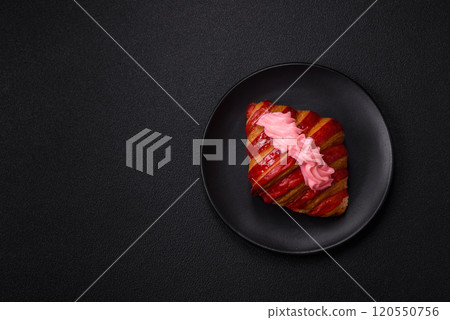 Crispy fresh red croissant with cream and strawberries Crispy fresh red croissant with cream and strawberries 120550756
