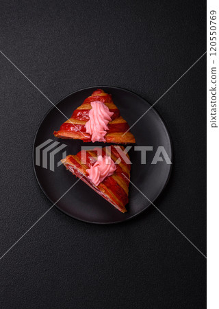 Crispy fresh red croissant with cream and strawberries 120550769