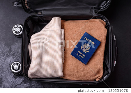 International passport of a USA citizen on a suitcase International passport of a USA citizen on a suitcase 120551078