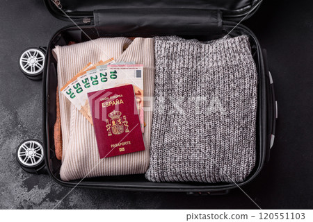 International passport of a citizen of Spain on a suitcase International passport of a citizen of Spain on a suitcase 120551103