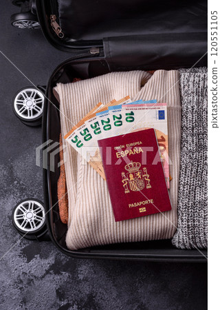 International passport of a citizen of Spain on a suitcase 120551105