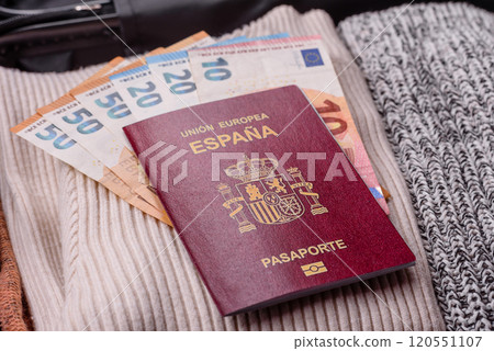 International passport of a citizen of Spain on a suitcase International passport of a citizen of Spain on a suitcase 120551107