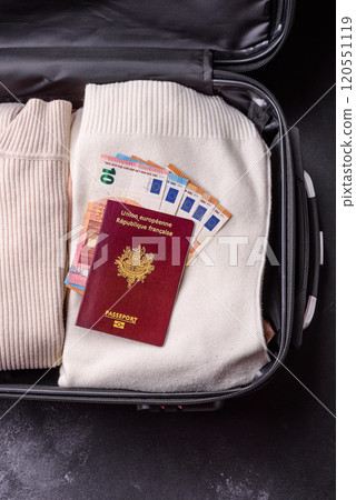 International passport of a French citizen on a suitcase 120551119