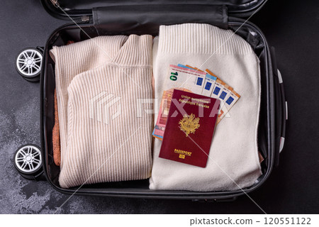 International passport of a French citizen on a suitcase 120551122