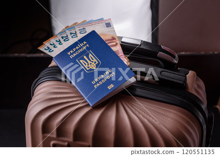 International passport of a citizen of Ukraine on a suitcase International passport of a citizen of Ukraine on a suitcase 120551135