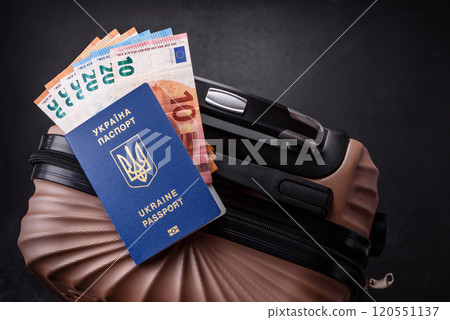 International passport of a citizen of Ukraine on a suitcase International passport of a citizen of Ukraine on a suitcase 120551137