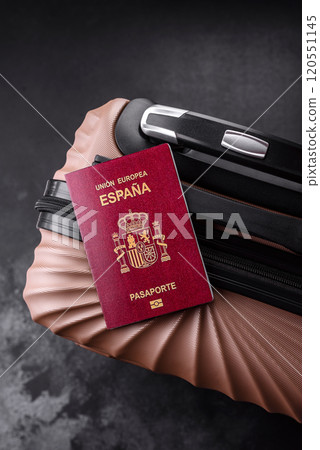 International passport of a citizen of Spain on a suitcase International passport of a citizen of Spain on a suitcase 120551145