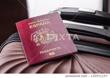 International passport of a citizen of Spain on a suitcase 120551147