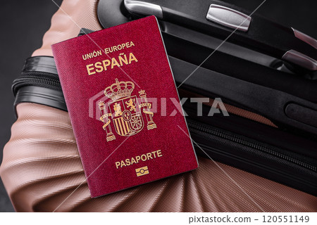 International passport of a citizen of Spain on a suitcase International passport of a citizen of Spain on a suitcase 120551149