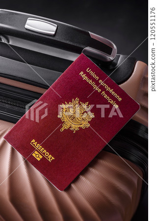 International passport of a French citizen on a suitcase 120551176