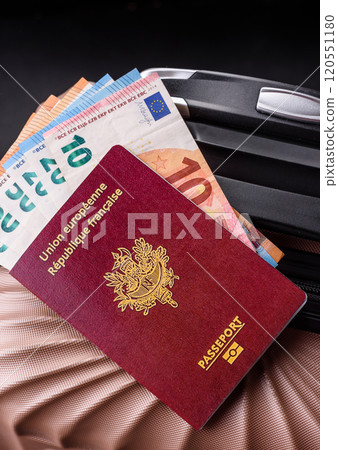 International passport of a French citizen on a suitcase 120551180