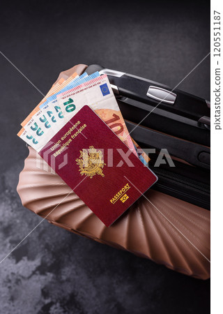 International passport of a French citizen on a suitcase 120551187