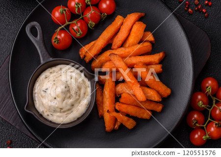 Delicious crispy sweet potato fries with salt, spices and herbs 120551576