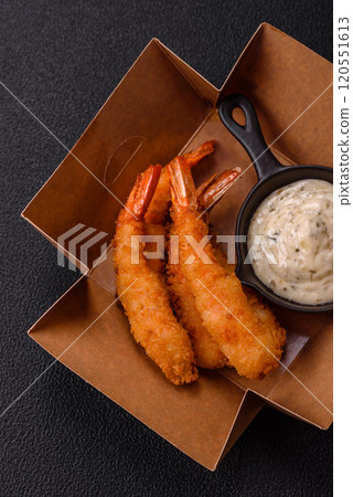 Hot crispy shrimp breaded with salt and spices with white sauce Hot crispy shrimp breaded with salt and spices with white sauce 120551613