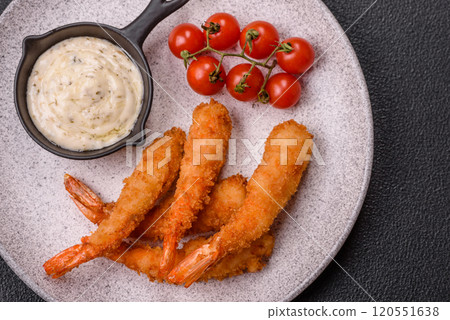 Hot crispy shrimp breaded with salt and spices with white sauce Hot crispy shrimp breaded with salt and spices with white sauce 120551638