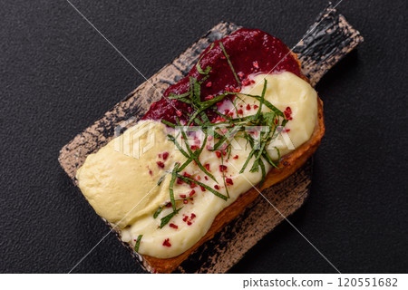 Delicious sweet brioche sandwich with raspberry jam and ricotta cream 120551682