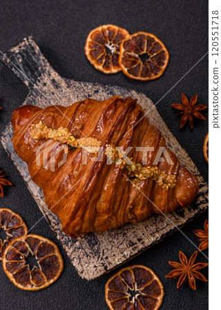 Fresh crispy croissant filled with pistachio cream 120551718