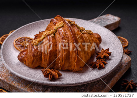 Fresh crispy croissant filled with pistachio cream 120551727