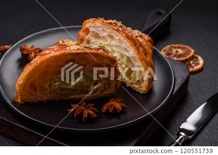Fresh crispy croissant filled with pistachio cream Fresh crispy croissant filled with pistachio cream 120551739