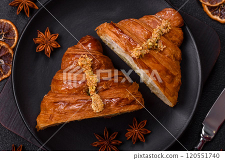 Fresh crispy croissant filled with pistachio cream Fresh crispy croissant filled with pistachio cream 120551740