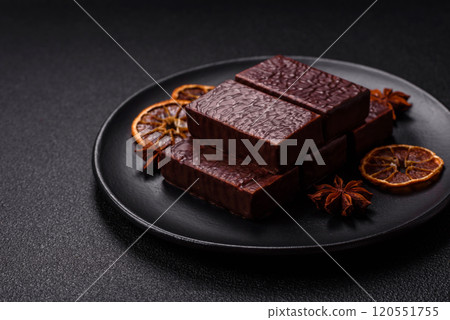 Rectangular chocolate candies with mousse and waffles 120551755