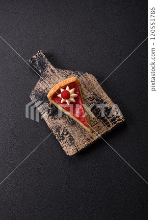 Delicious sweet dessert cheesecake with raspberry and pistachio flavor Delicious sweet dessert cheesecake with raspberry and pistachio flavor 120551786