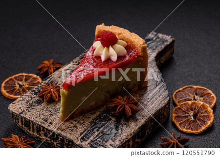 Delicious sweet dessert cheesecake with raspberry and pistachio flavor 120551790