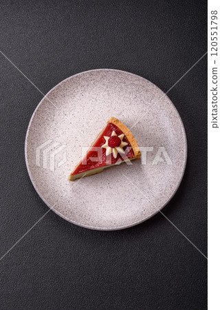 Delicious sweet dessert cheesecake with raspberry and pistachio flavor 120551798