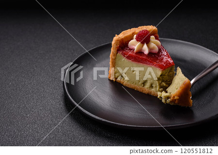 Delicious sweet dessert cheesecake with raspberry and pistachio flavor 120551812