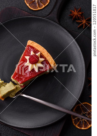 Delicious sweet dessert cheesecake with raspberry and pistachio flavor Delicious sweet dessert cheesecake with raspberry and pistachio flavor 120551817