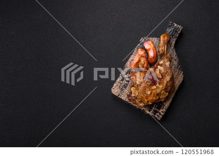 Duck leg baked with apples and sauce 120551968