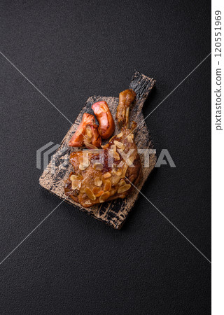 Duck leg baked with apples and sauce Duck leg baked with apples and sauce 120551969