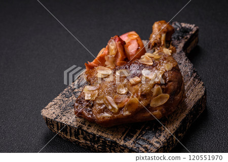 Duck leg baked with apples and sauce Duck leg baked with apples and sauce 120551970