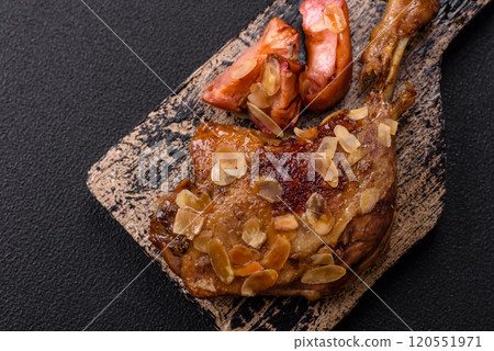 Duck leg baked with apples and sauce 120551971