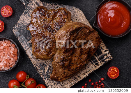 Juicy beef steak grilled with salt, spices and herbs Juicy beef steak grilled with salt, spices and herbs 120552009