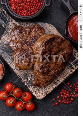 Juicy beef steak grilled with salt, spices and herbs Juicy beef steak grilled with salt, spices and herbs 120552010
