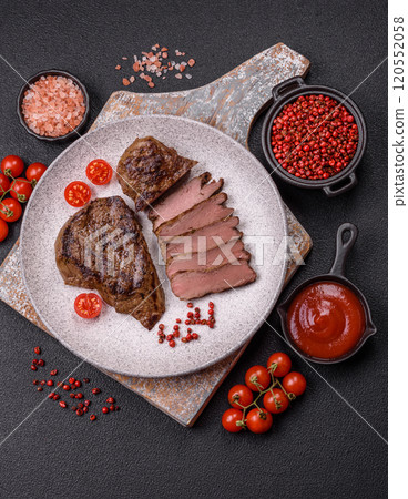 Juicy beef steak grilled with salt, spices and herbs Juicy beef steak grilled with salt, spices and herbs 120552058