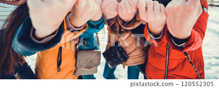Boys and girls are playing in snowballs. Active outdoors leisure with family with children in winter. Winter holidays. Boys and girls are playing in snowballs. Active outdoors leisure with family with children in winter. Winter holidays. 120552305