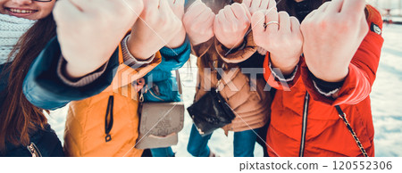Boys and girls are playing in snowballs. Active outdoors leisure with family with children in winter. Winter holidays. Boys and girls are playing in snowballs. Active outdoors leisure with family with children in winter. Winter holidays. 120552306