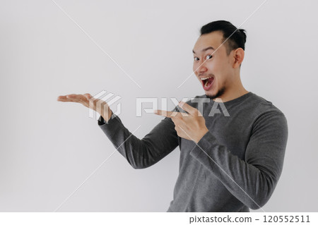 Wow surprise face man in grey fleece base layer offer present on white. Wow surprise face man in grey fleece base layer offer present on white. 120552511