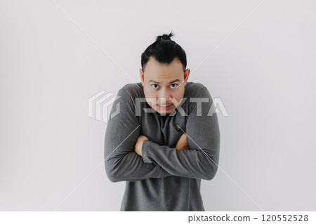 Cold man in grey fleece base layer stand chilling isolate on white. Cold man in grey fleece base layer stand chilling isolate on white. 120552528