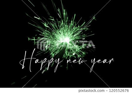 Happy new year green sparkler new years eve countdown. Luxury entertainment celebration turn of the year party time. Premium nightlife visual with glowing light sparks on dark background. 120552676